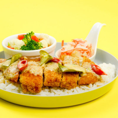 Image of Authentic Thai Green Curry Chicken Chop served with pickled vegetables and tomato soup
